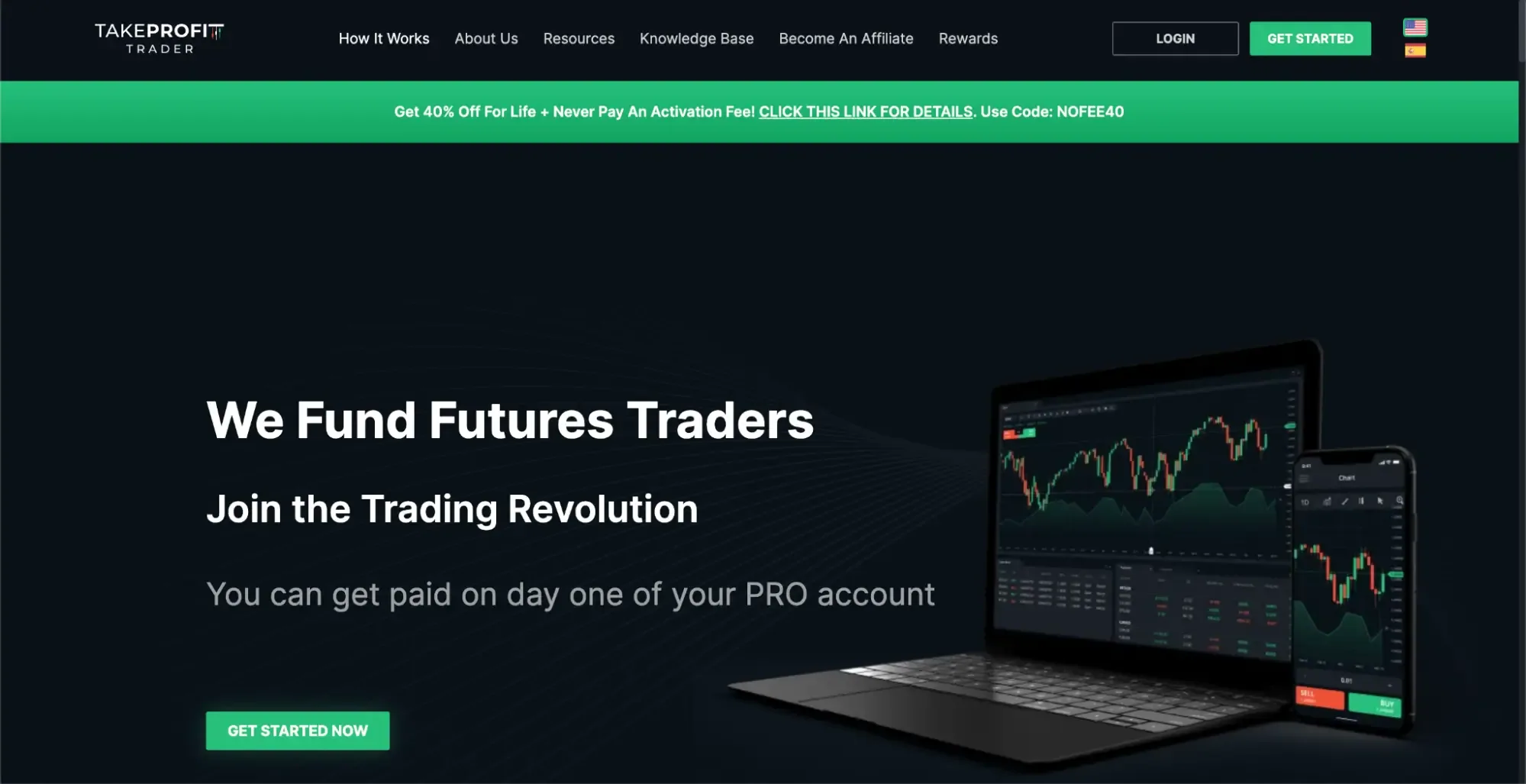 Take Profit Trader’s homepage with the hero “We fund futures traders” with a laptop and smartphone with trading graphs to the right.